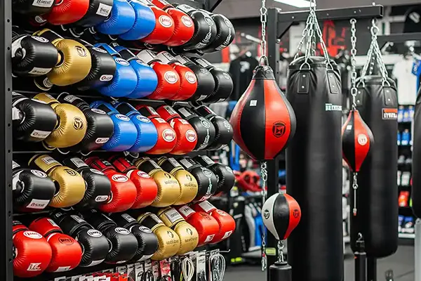 Wholesale boxing gloves and punching bags displayed in gym equipment showroom